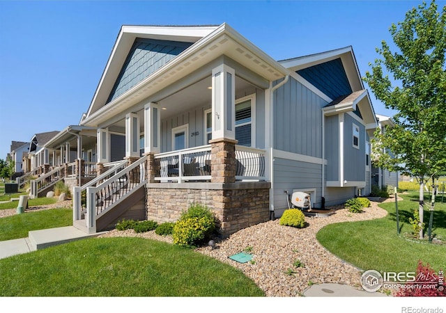 view of home's exterior featuring covered porch and a lawn