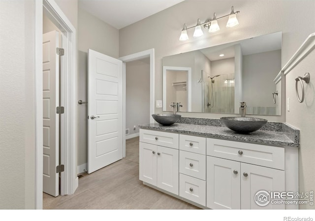 bathroom with vanity and walk in shower