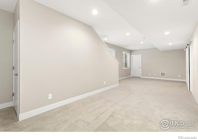 interior space featuring a barn door