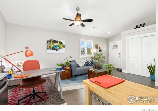 office featuring lofted ceiling, ceiling fan, and dark wood-type flooring