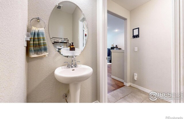 bathroom with tile patterned flooring