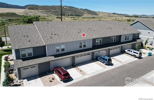 view of front of home featuring a mountain view