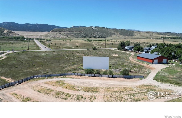 aerial view with a mountain view and a rural view