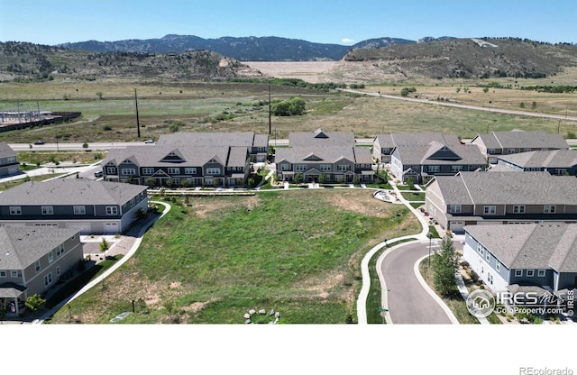 drone / aerial view featuring a mountain view