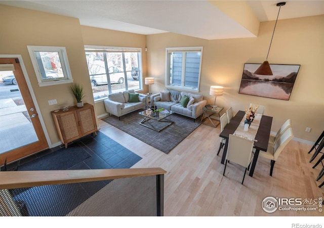 living room with baseboards and wood finished floors