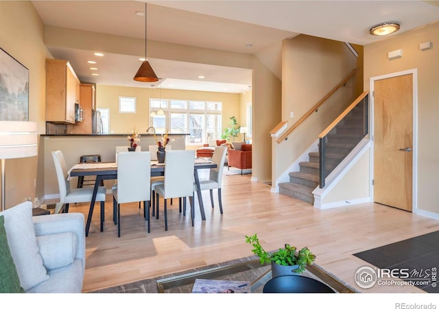 dining space featuring light hardwood / wood-style floors