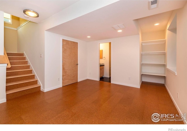 interior space with baseboards, stairs, visible vents, and recessed lighting