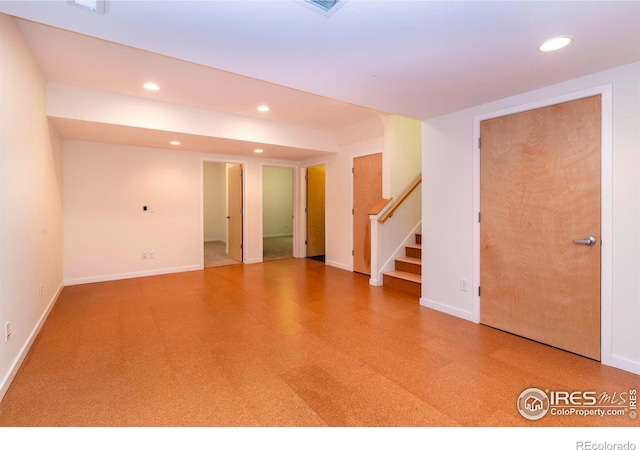 unfurnished room featuring recessed lighting, stairs, baseboards, and tile patterned floors