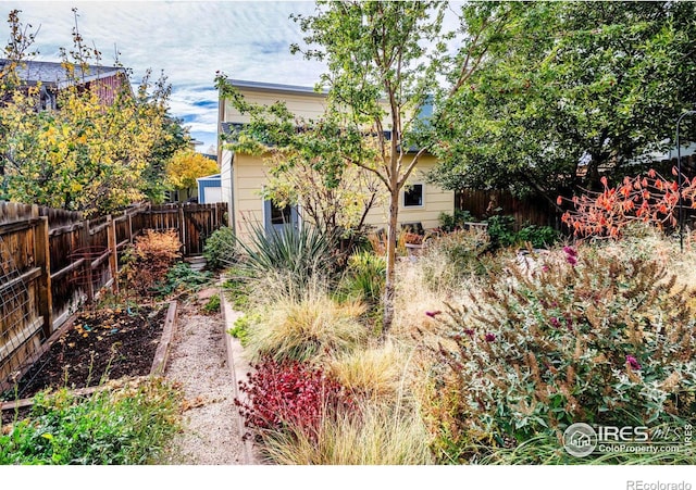 view of yard featuring a garden and fence