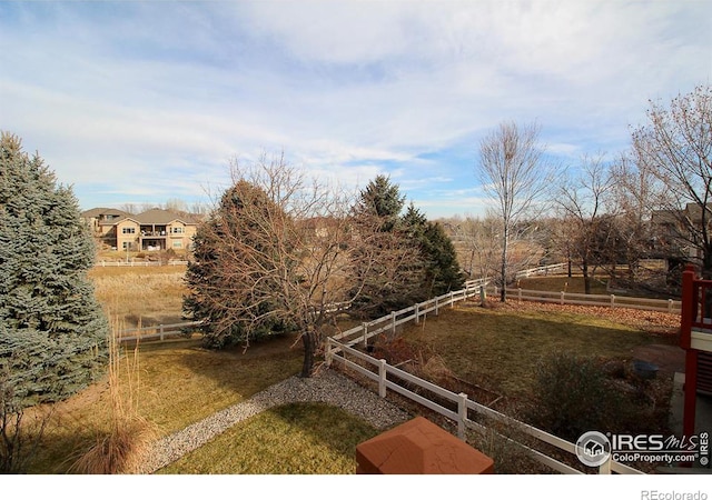 view of yard with a rural view