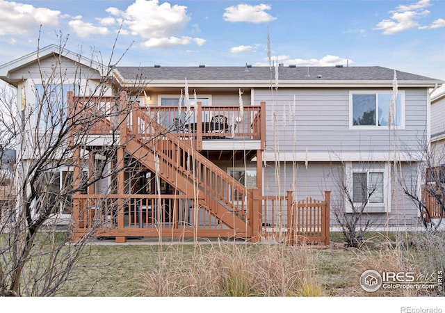 rear view of house with a wooden deck