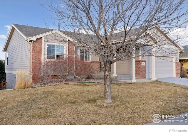 view of front of house with a garage and a front yard