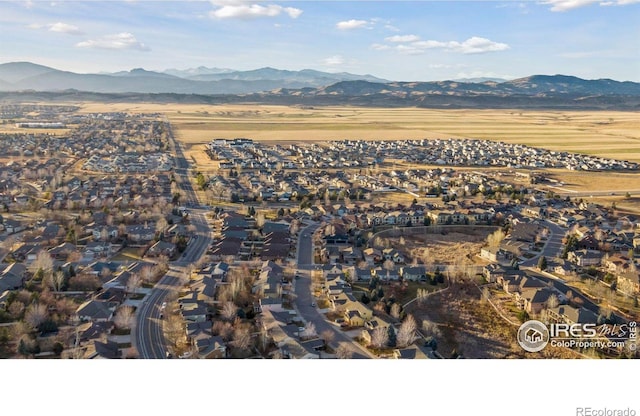 birds eye view of property with a mountain view