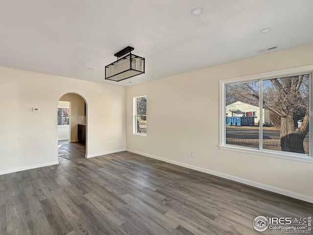 unfurnished room featuring dark hardwood / wood-style floors