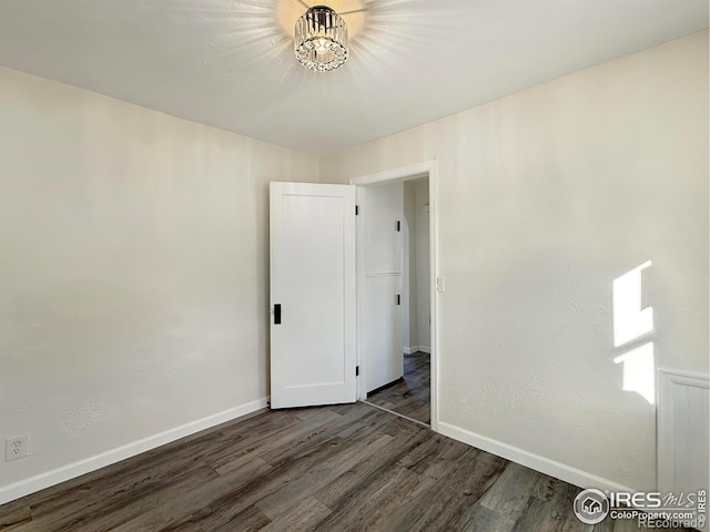 empty room featuring dark hardwood / wood-style floors