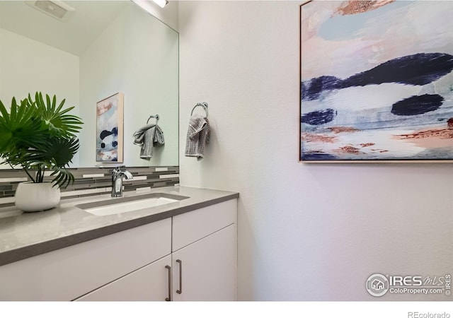 1998 Foxtail Ln Unit B, Lafayette, CO 80026 - bathroom featuring decorative backsplash and vanity
