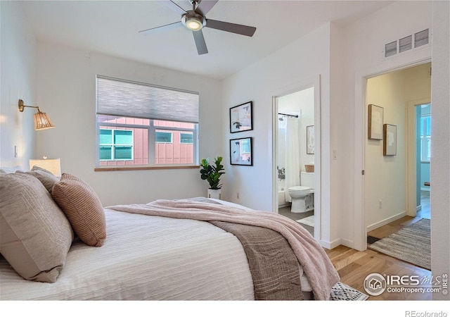 1998 Foxtail Ln Unit B, Lafayette, CO 80026 - bedroom featuring wood finished floors, ensuite bath, baseboards, and a ceiling fan