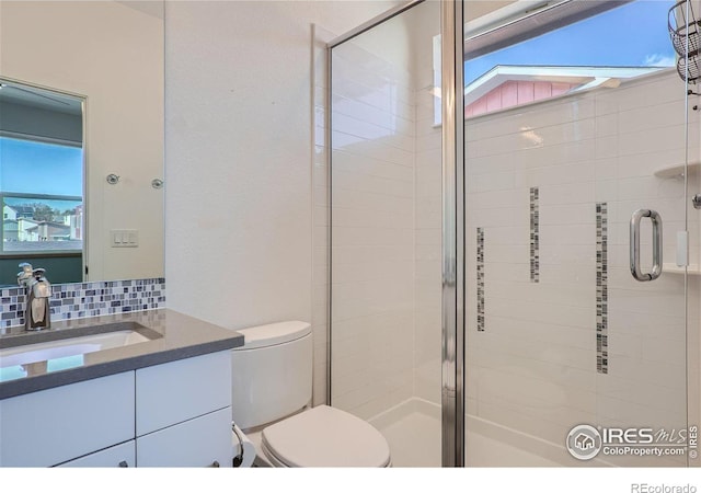 1998 Foxtail Ln Unit B, Lafayette, CO 80026 - bathroom with a stall shower, vanity, toilet, and backsplash