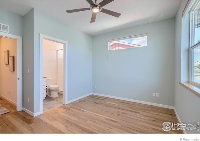1998 Foxtail Ln Unit B, Lafayette, CO 80026 - unfurnished bedroom featuring light wood-style flooring, multiple windows, and baseboards