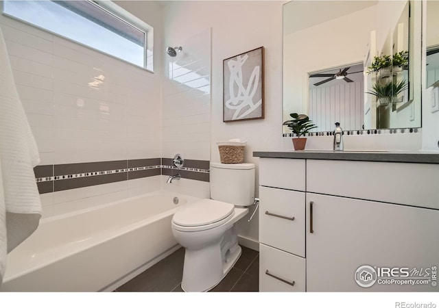 1998 Foxtail Ln Unit B, Lafayette, CO 80026 - full bathroom with shower / bathtub combination, toilet, vanity, tile patterned flooring, and ceiling fan