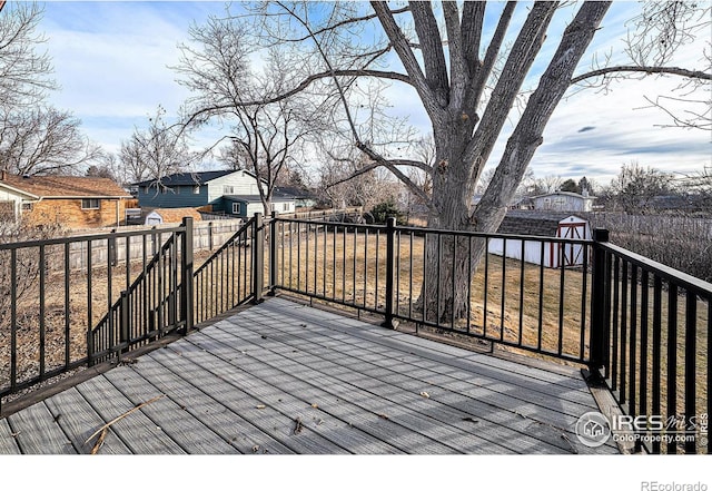 deck featuring a shed