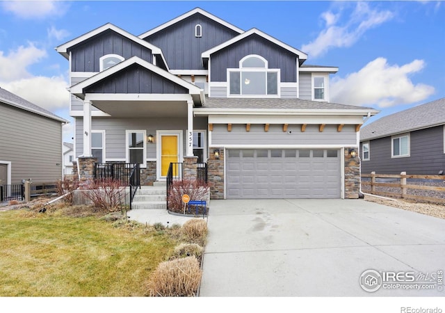 craftsman-style house featuring a front yard and a garage