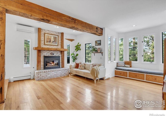 unfurnished living room with a wall unit AC, a fireplace, baseboard heating, light wood-type flooring, and beam ceiling