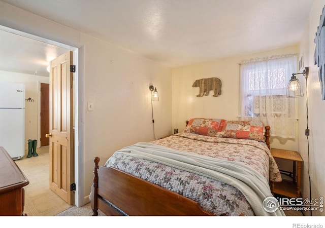 bedroom featuring white fridge