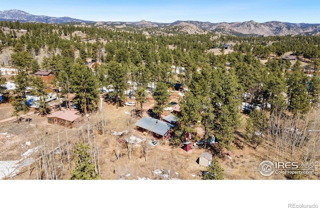 birds eye view of property featuring a mountain view