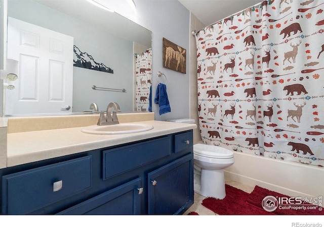 full bathroom with tile patterned flooring, vanity, toilet, and shower / bath combo with shower curtain