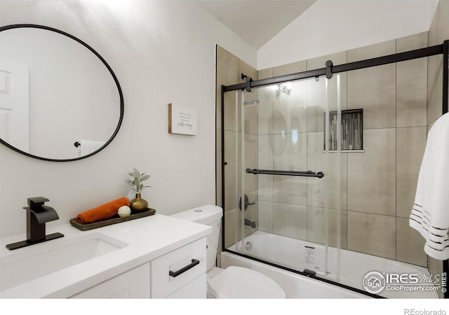 full bathroom with lofted ceiling, shower / bath combination with glass door, toilet, and vanity