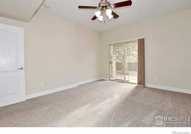 empty room with ceiling fan and carpet