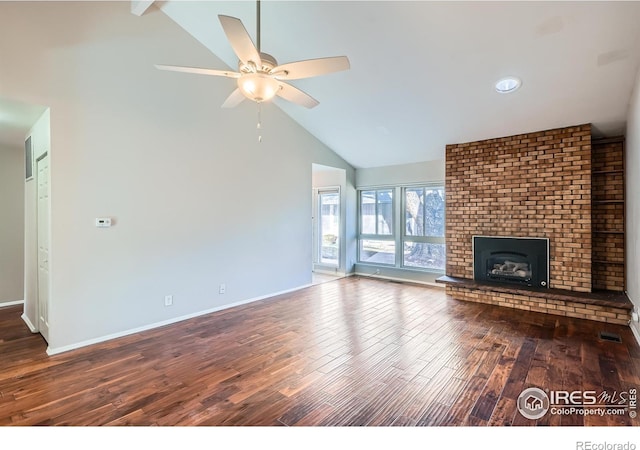 unfurnished living room featuring high vaulted ceiling, a brick fireplace, hardwood / wood-style flooring, ceiling fan, and beam ceiling