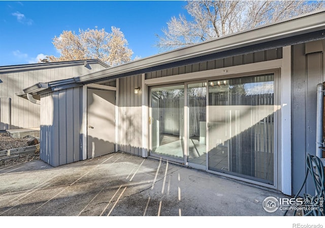 doorway to property featuring a patio area