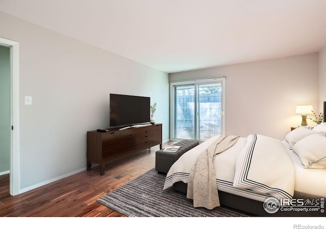 bedroom featuring dark hardwood / wood-style flooring