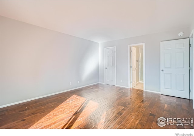 unfurnished bedroom featuring hardwood / wood-style flooring