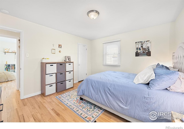 bedroom with light hardwood / wood-style flooring