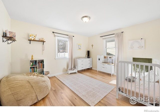 bedroom with light wood-type flooring