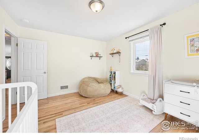 bedroom with hardwood / wood-style flooring