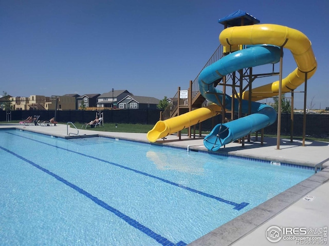 view of pool with a water slide