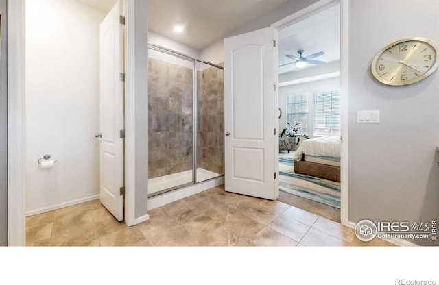 bathroom featuring ceiling fan and walk in shower