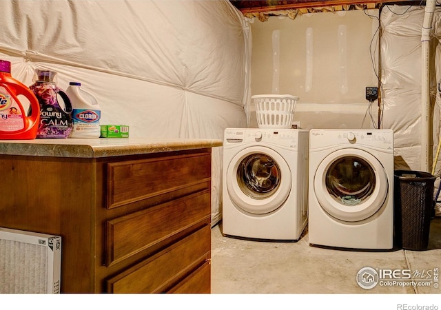 laundry area with independent washer and dryer