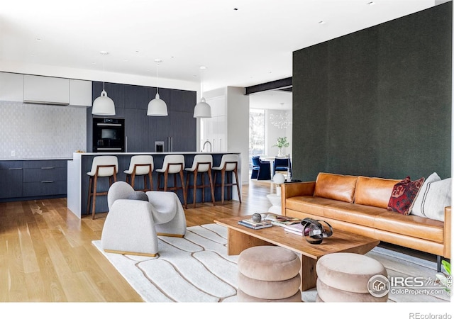 living room with light hardwood / wood-style flooring