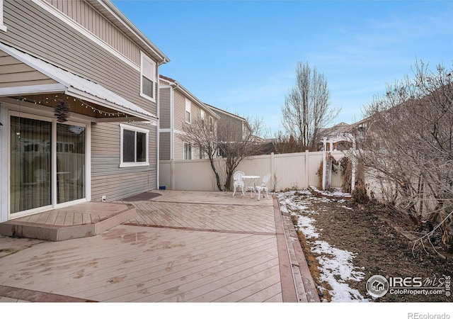 view of snow covered deck