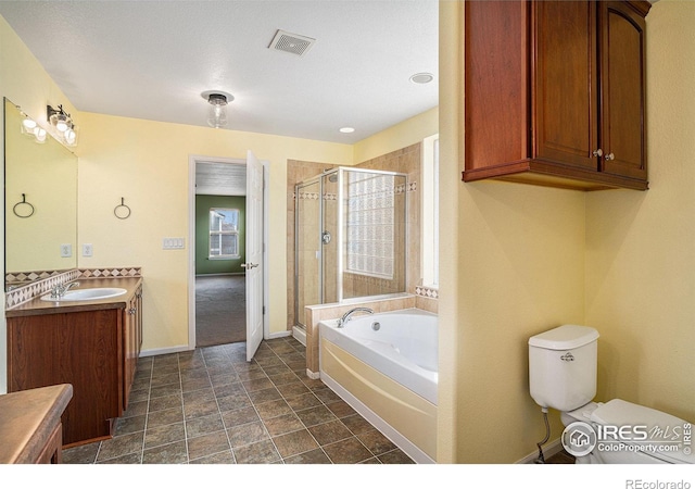 full bathroom featuring vanity, separate shower and tub, and toilet