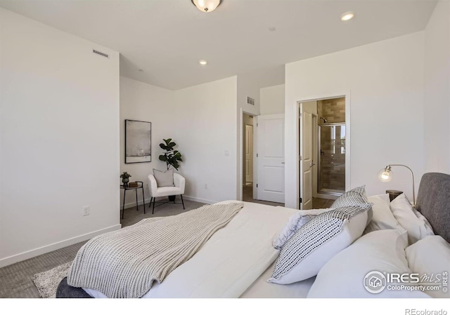 bedroom featuring ensuite bathroom and carpet flooring