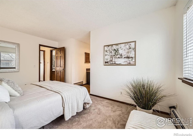 bedroom featuring carpet flooring, baseboard heating, and a textured ceiling