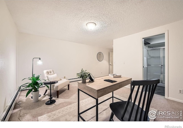 carpeted office featuring a textured ceiling and a baseboard radiator