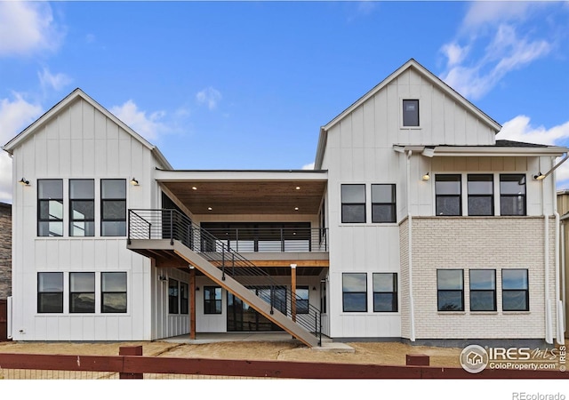 rear view of property with a wooden deck