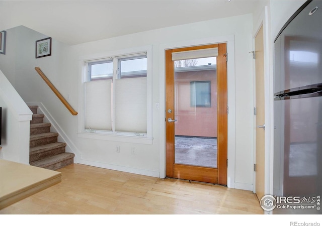 entrance foyer featuring light hardwood / wood-style floors